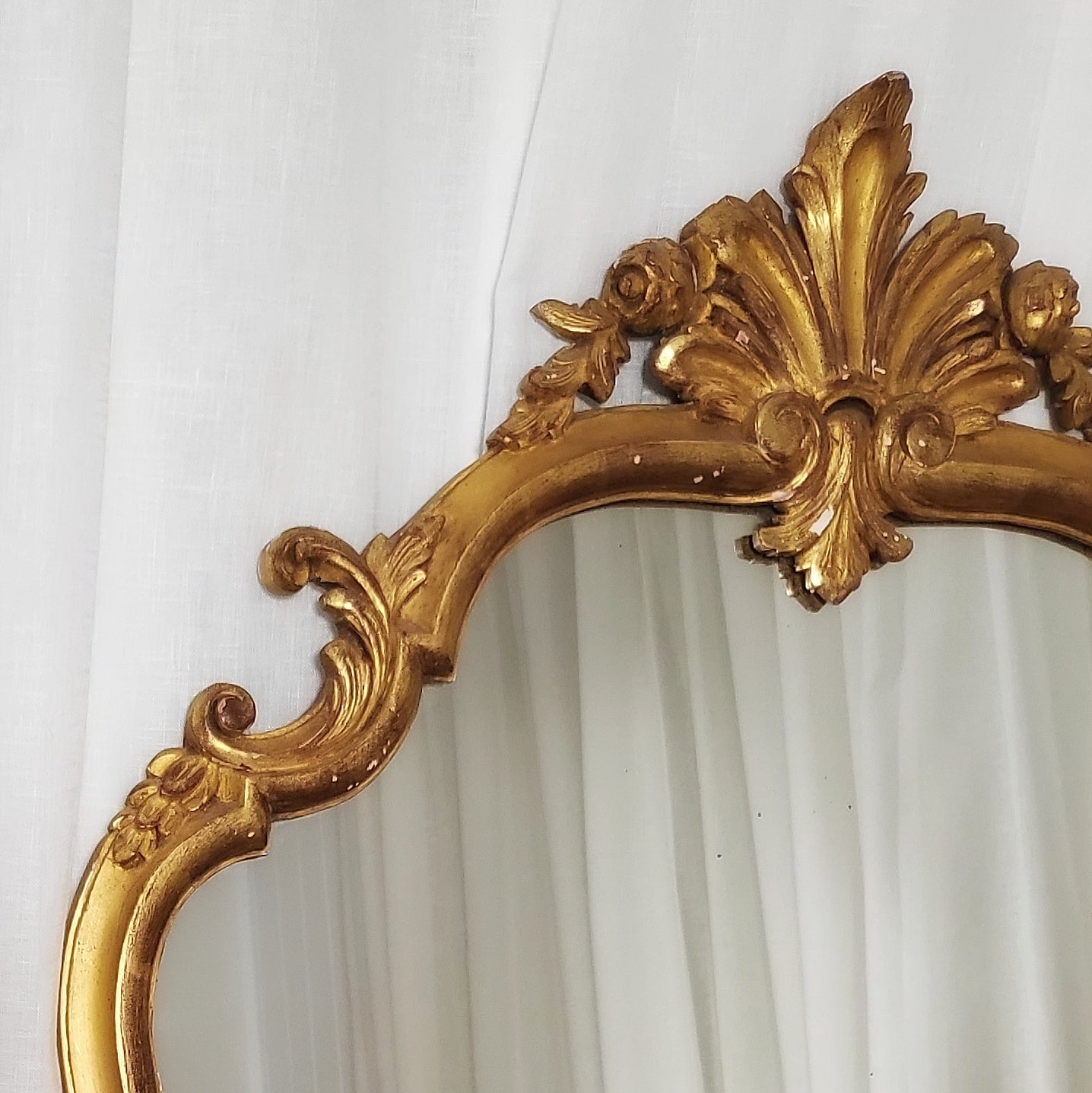 Close-up of 19th-century gilt and gesso floral crest detailing
