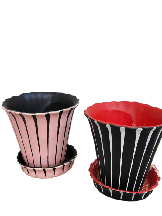 Pair of rare mid-century Barsony planters — one pink (unnumbered), one red (numbered) — with scalloped rims and black graphic striping.