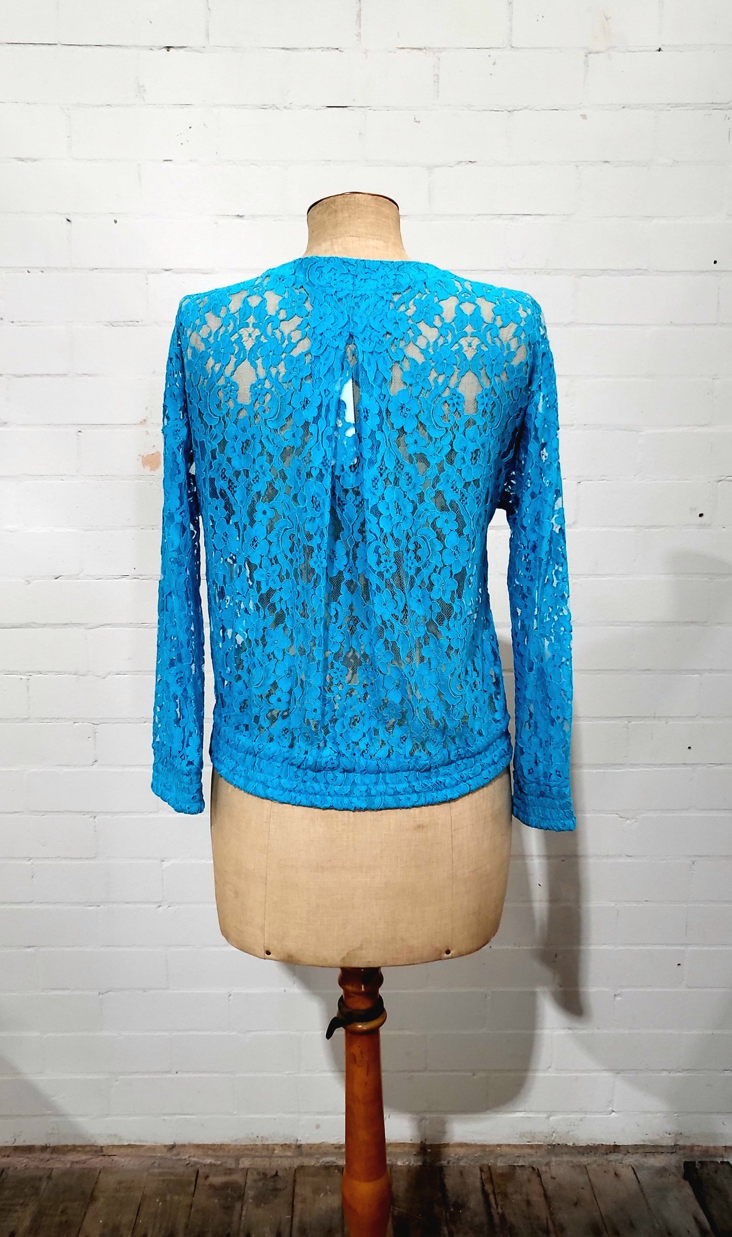 Back view of Zimmermann blue lace Flip Side Lace Bomber cardigan