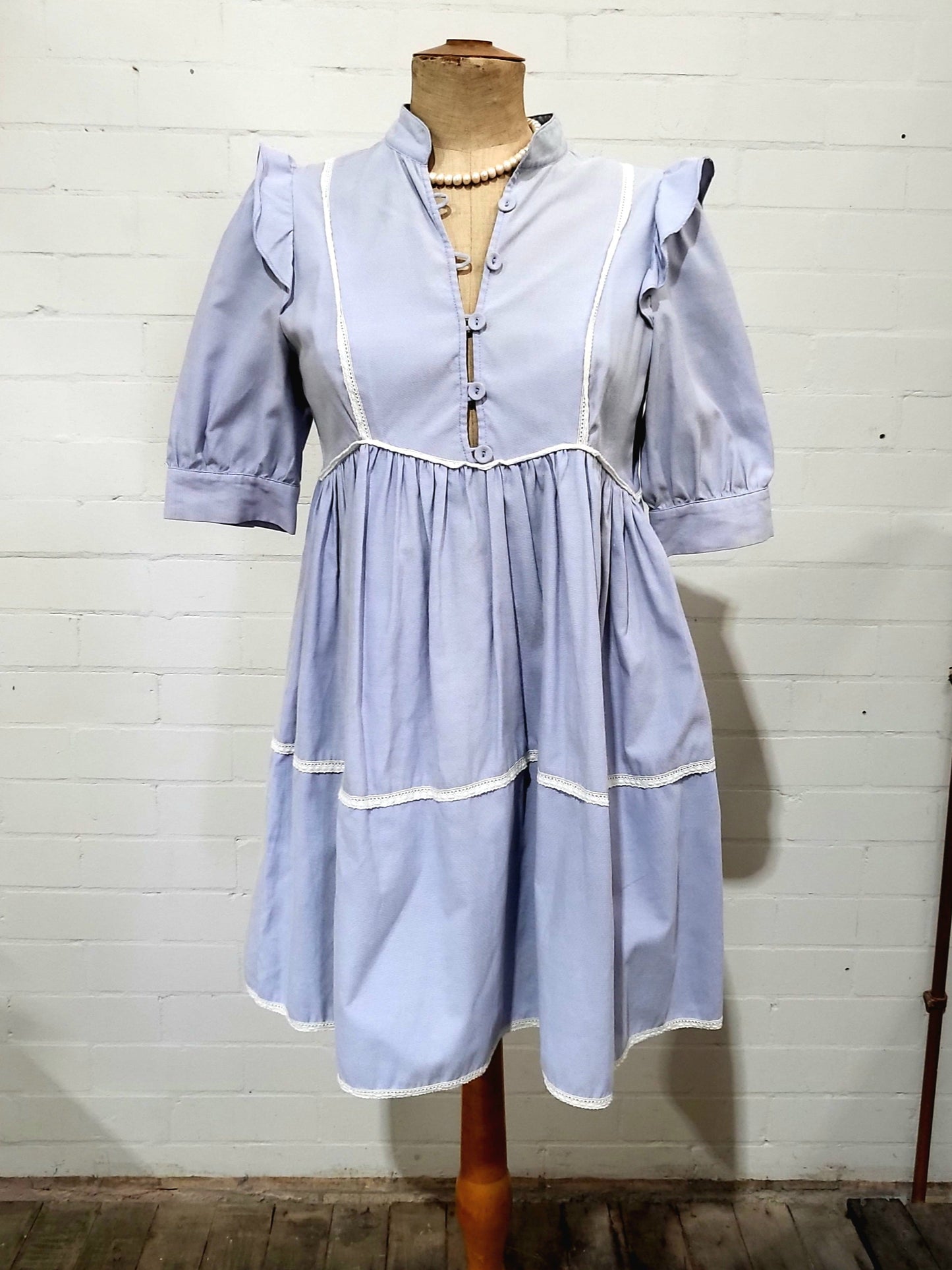 Front view of vintage Zimmermann lilac dress with lace trim and puff sleeves