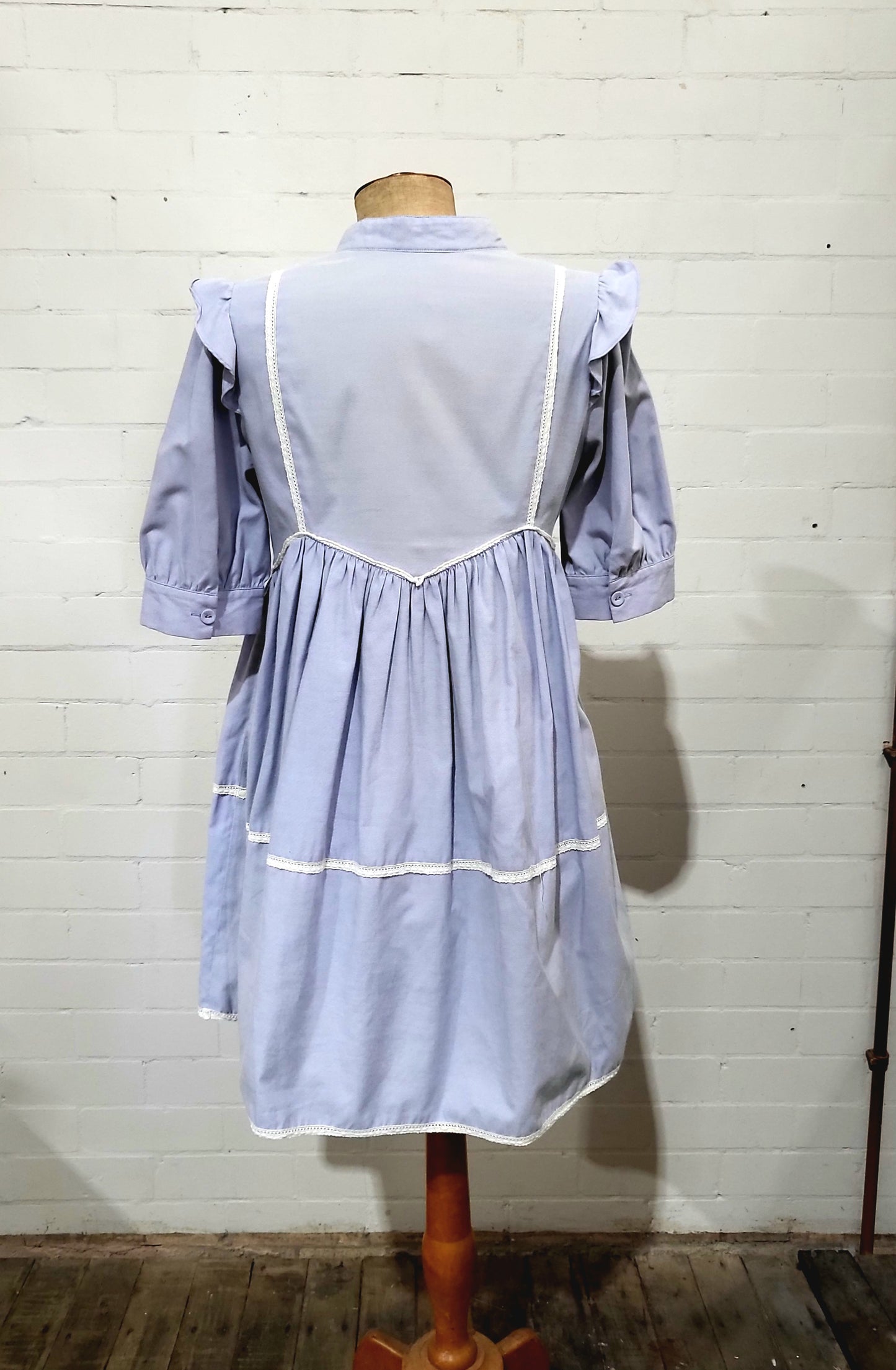 Back view of vintage Zimmermann lilac dress showing lace detail and tiered skirt