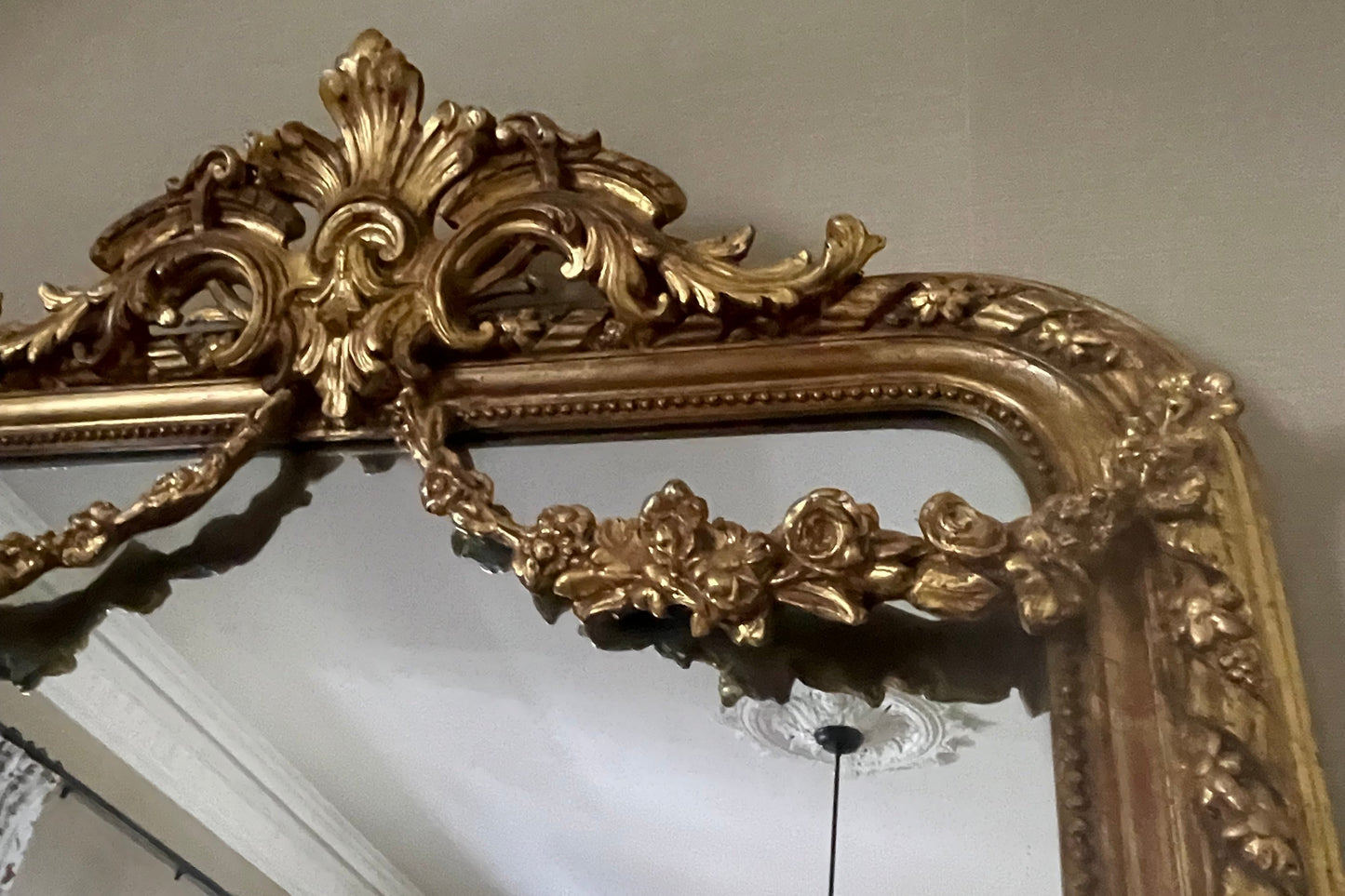 Antique French mirror with swag and crest decoration