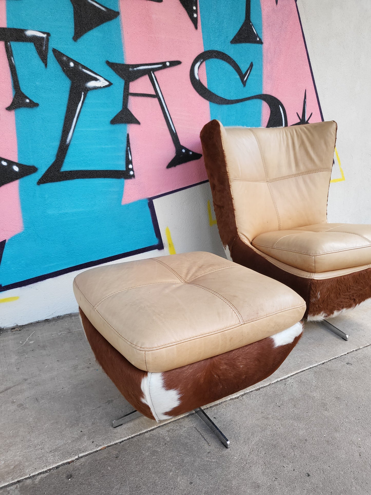 Cow Hide and Leather Swivel Armchair and Ottoman