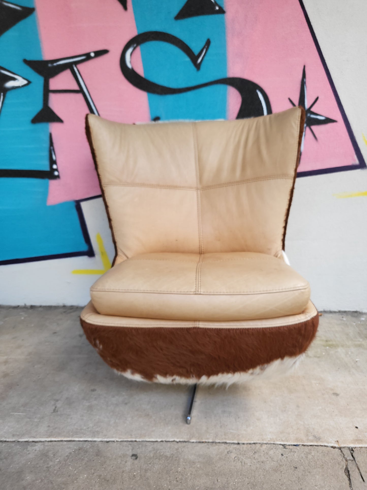 Cow Hide and Leather Swivel Armchair and Ottoman