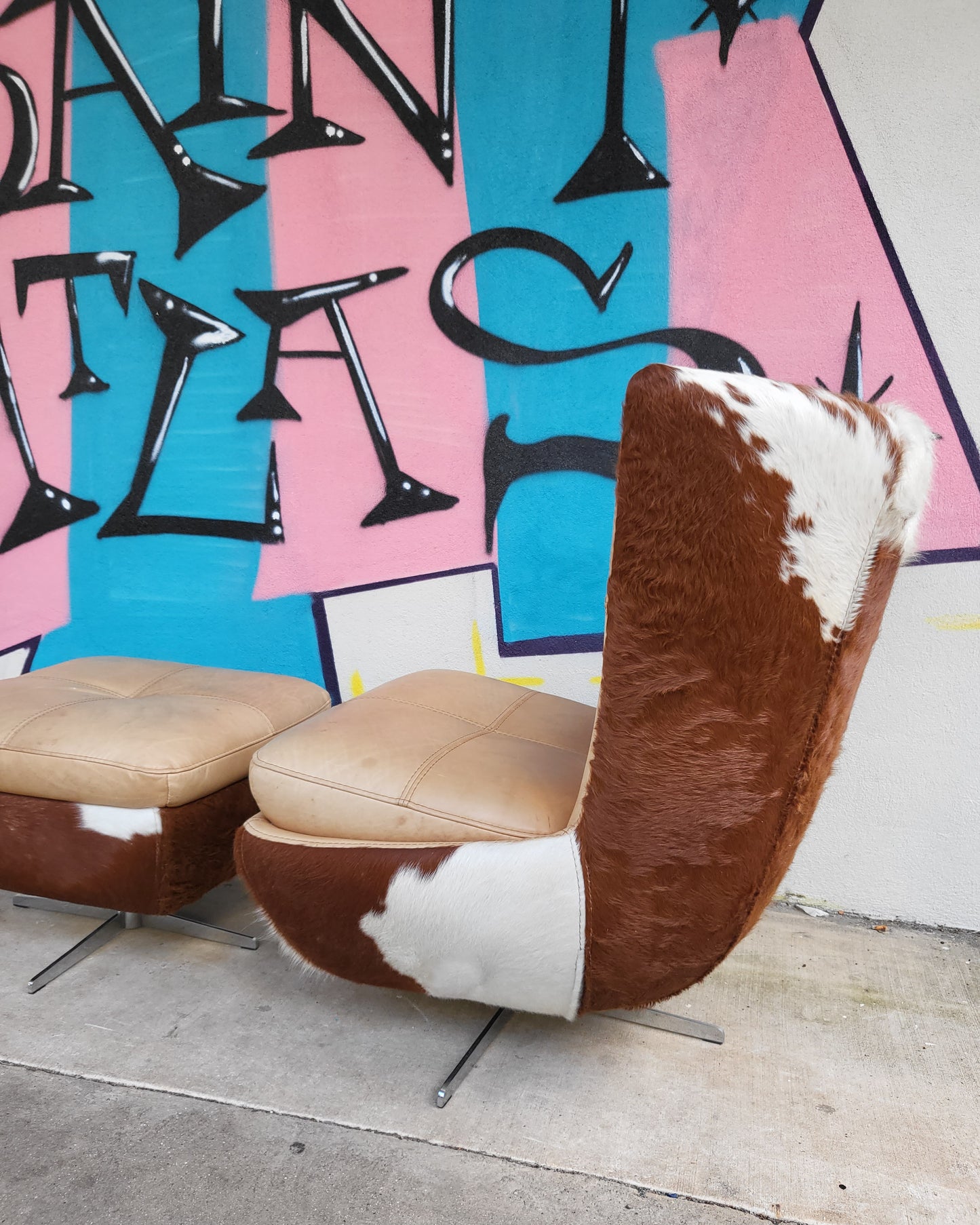 Cow Hide and Leather Swivel Armchair and Ottoman