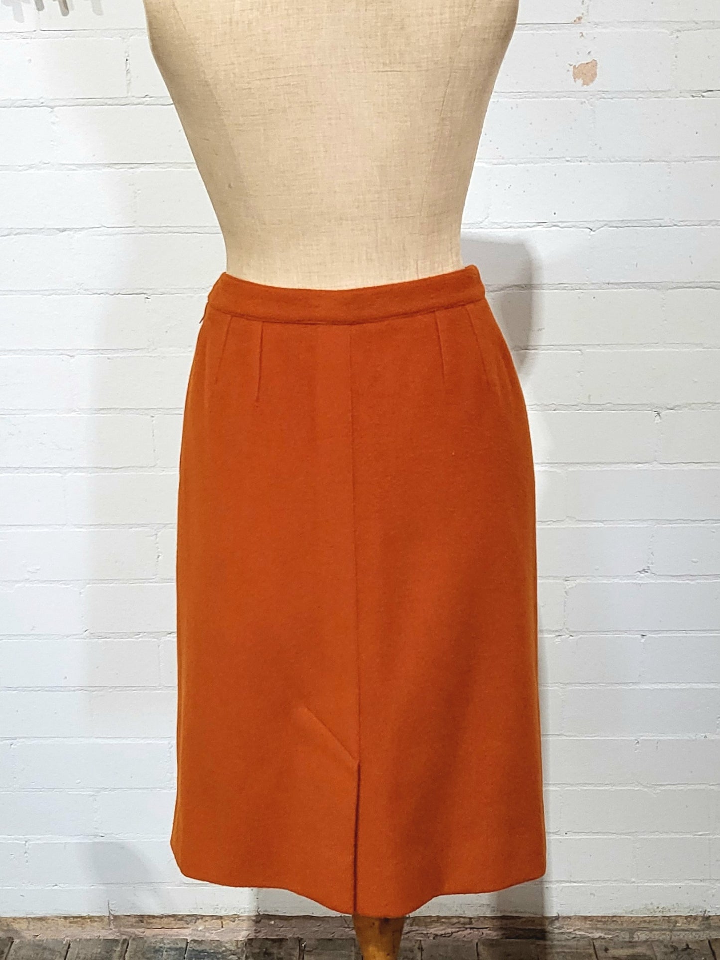 Back of vintage Hermès Paris rust wool skirt from the 1980s