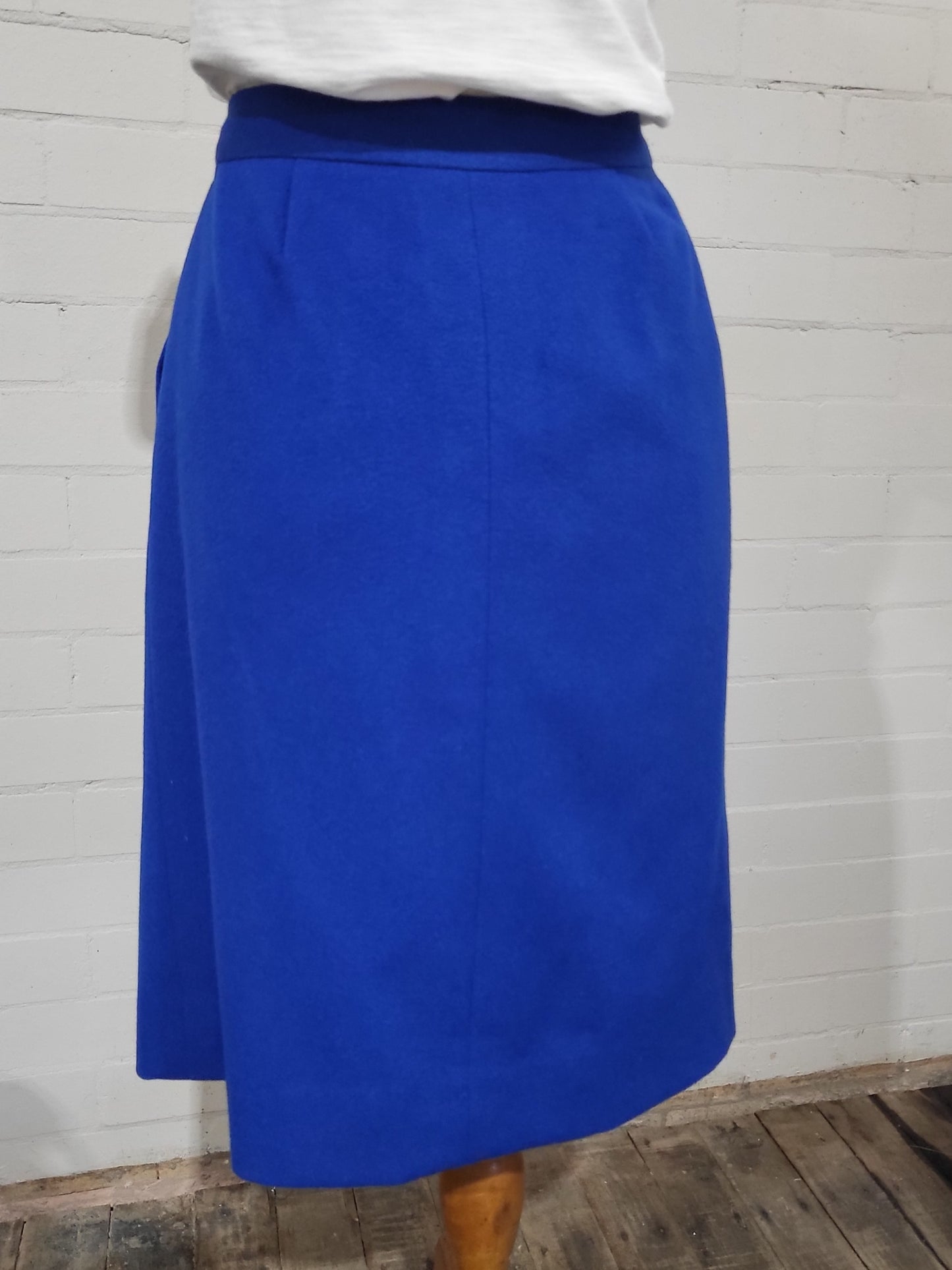 Back of Hermès 1980s blue wool wrap skirt with structured silhouette