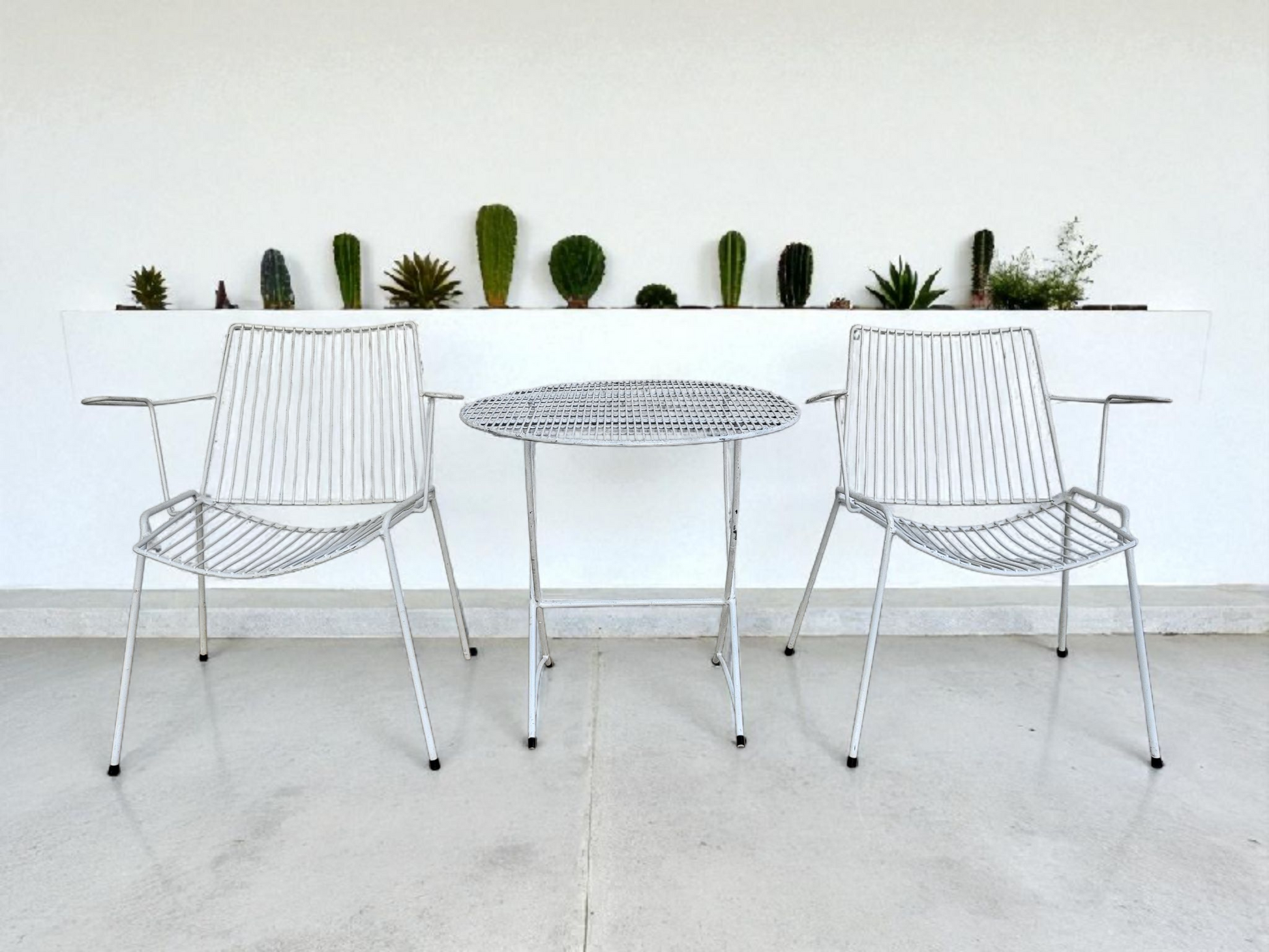 Vintage Breotex outdoor set styled outdoors, showcasing light airy lines and classic mid-century form.