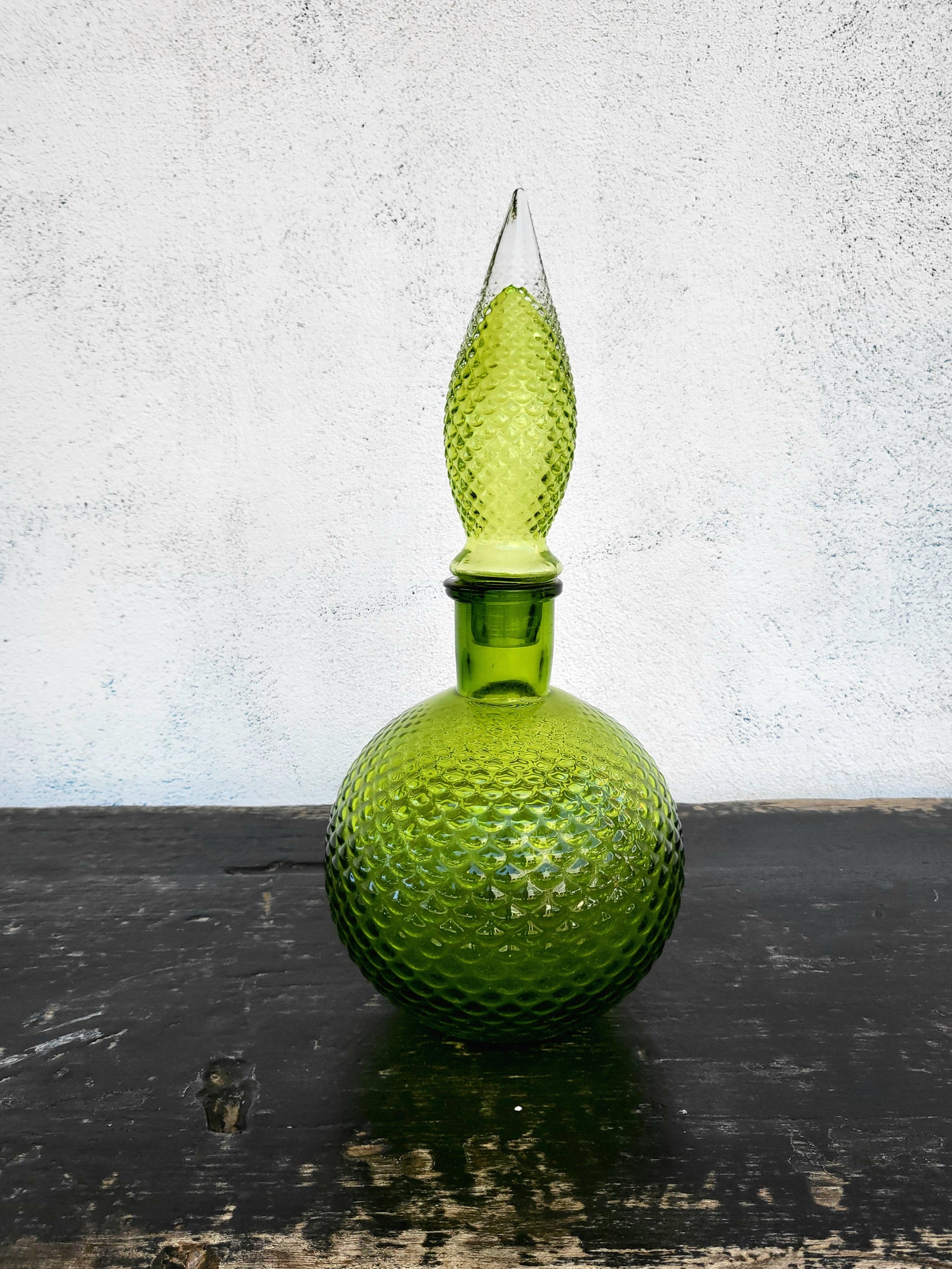 Vintage green diamond-pattern hobnail genie bottle with elongated stopper.