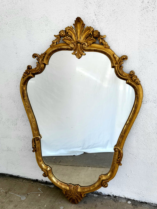 Full view of antique French mirror showing Rococo C-scroll design