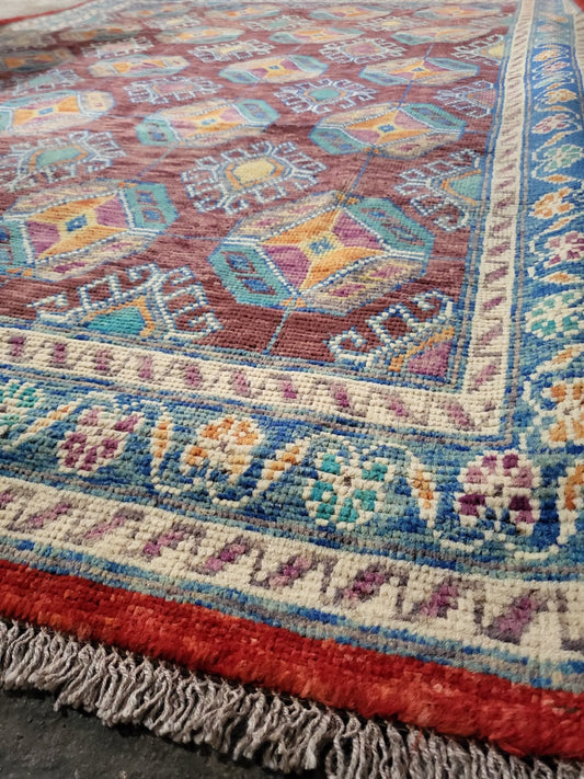 Afghan Chobi rug – hand-knotted wool with geometric tribal design in vegetable dyes, 242 x 183 cm