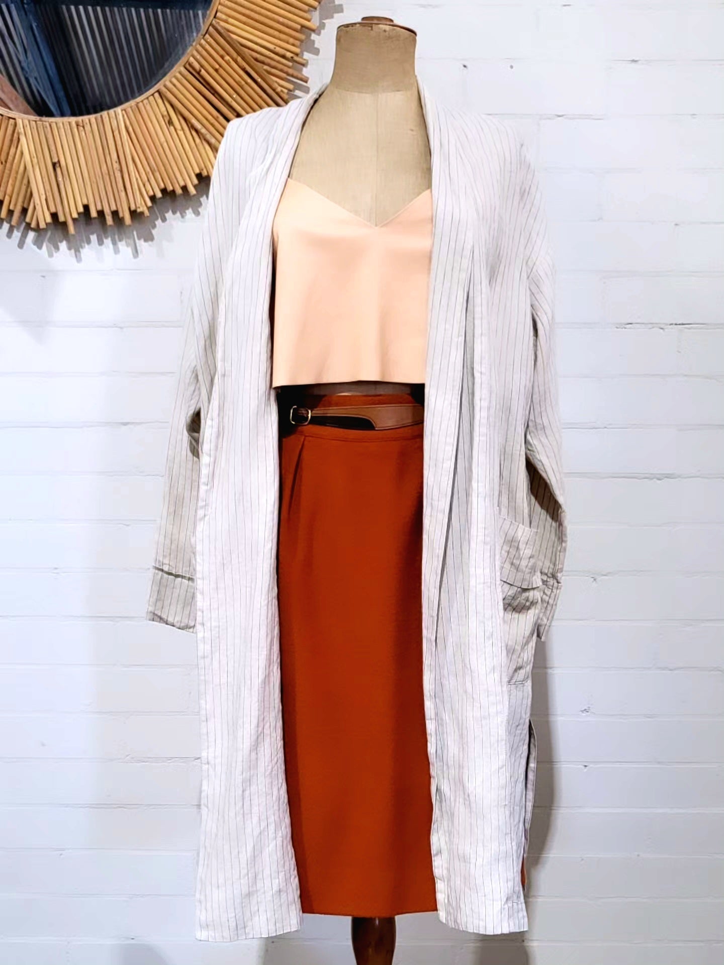 Vintage 1980s Hermès rust wool skirt with front pleats and gold buckle detail
