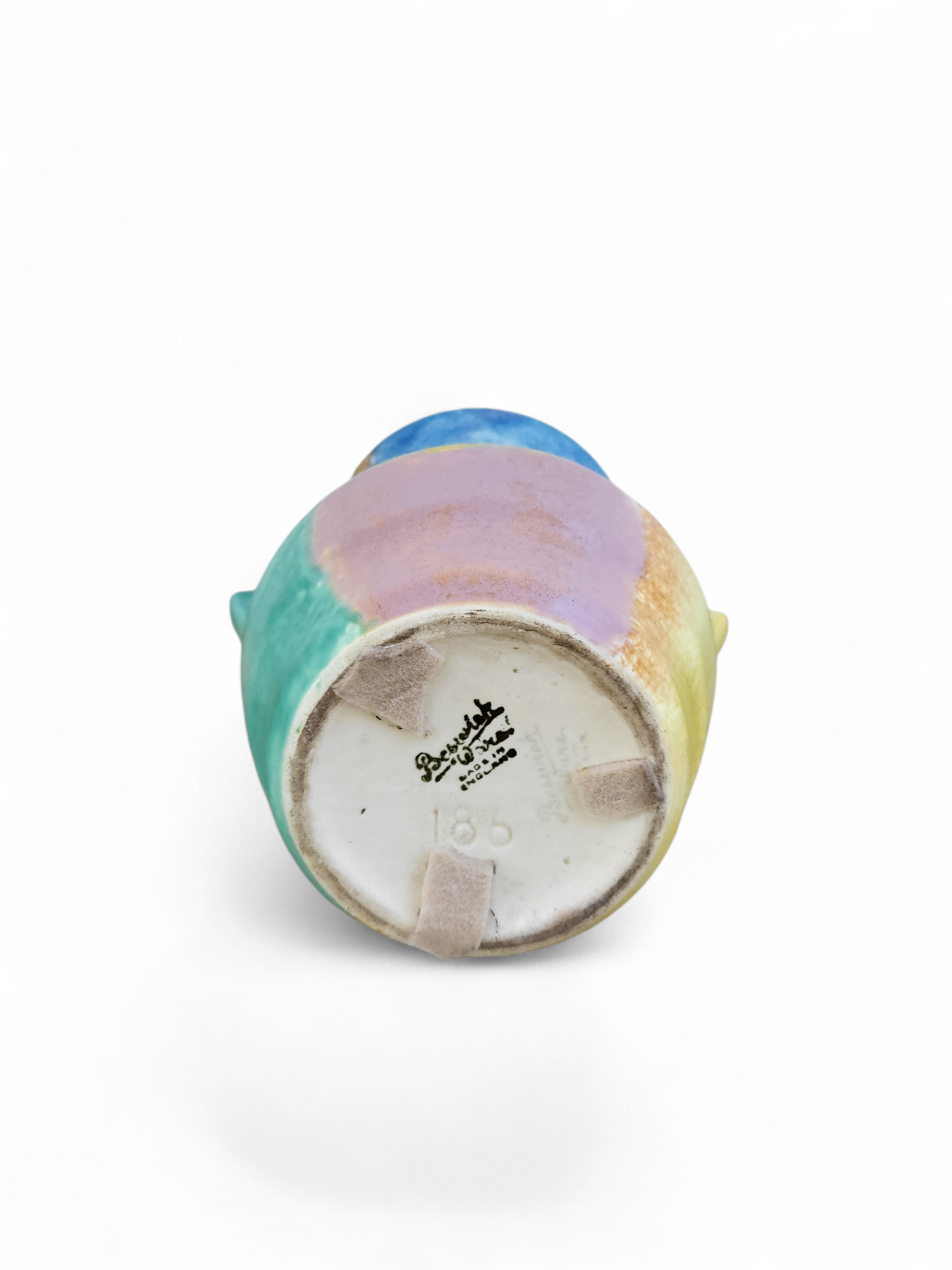 Mid-century Beswick art pottery vase with twin handles, multicolour abstract glaze and Beswick England base mark, photographed from the underside.
